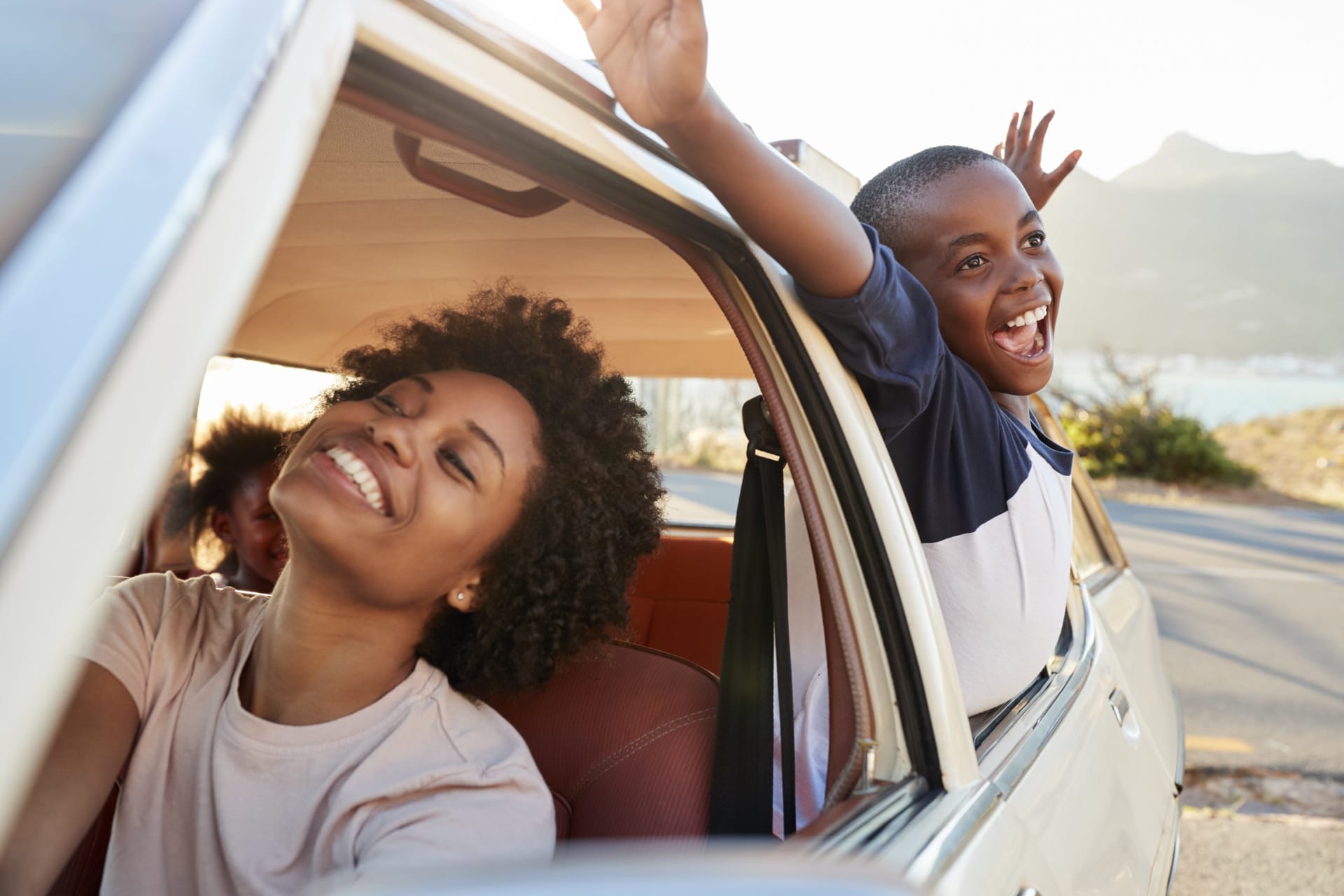 Automobile traveling along an open highway representing comprehensive auto coverage